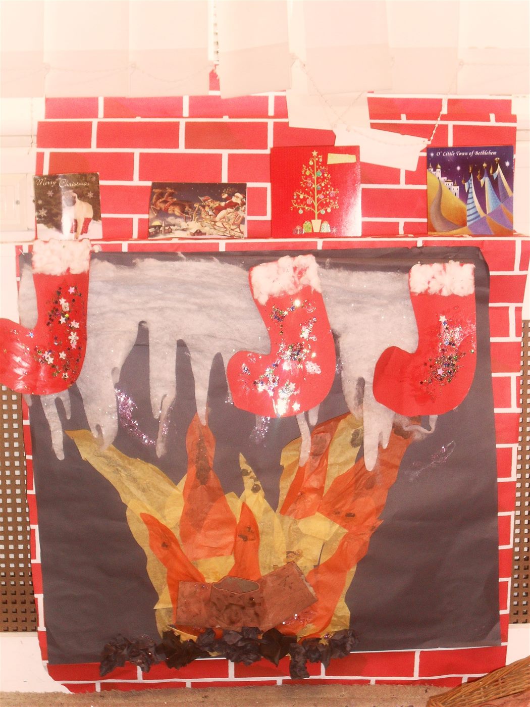 A Christmas fireplace display in one of the nursery rooms